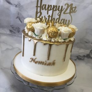 Buttercream cake with gold drip and roses