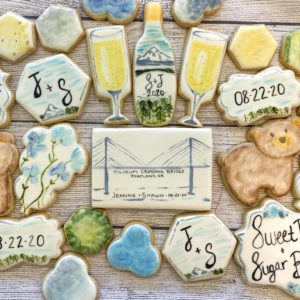 Painted wedding cookies for a couple in Portland using their nicknames for each other as inspiration. 