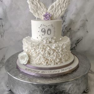 Ruffled cake with wings and lavender accents