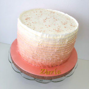 A ruffle cake wit ombre rose gold airbrush