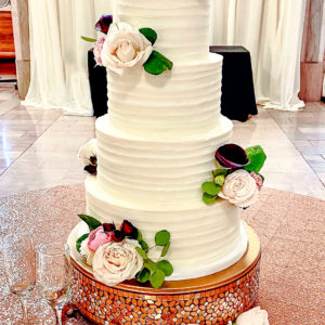 Textured buttercream wedding cake with flowers