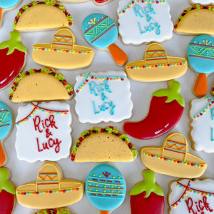 A set of fiesta themed wedding cookies.