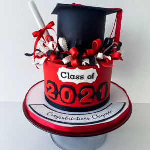 Red, black and white graduation cake