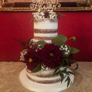 Three tiered naked cake with fresh flowers