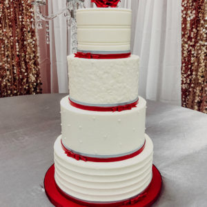 Classic buttercream cake with red accents