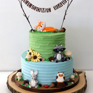 Rustic buttercream cake with modeled fondant figurines.