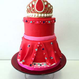 Two tiered fondant cake mimicking the dress and crown of Eleanor of Avalor 