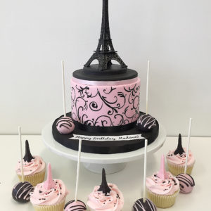 Royal icing filigree cake with cake pops and cupcakes with chocolate towers on top