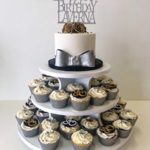 Eightieth birthday cake with silver and gold decorations 