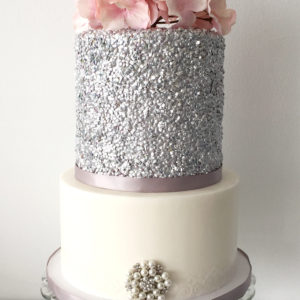 Silver edible sequin  birthday cake with silk flowers o top