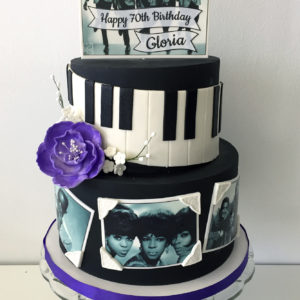 Fondant cake with edible Motown pictures and sugar flowers
