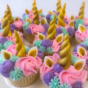Multiple colored buttercream with gold horns and ears