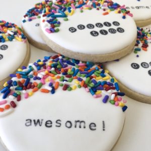 Royal icing cookies with sprinkles and stamped words