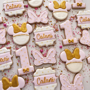 First birthday cookies in pink and white with gold accents