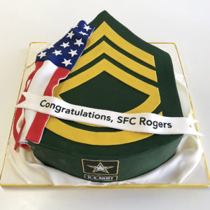 Cake carved in shape of new rank with fondant flag